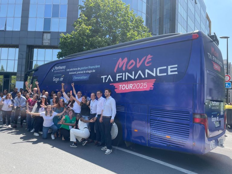 Participants in Parthena’s roadshow raising their arms in front of the coach wrapped in the tour’s colours