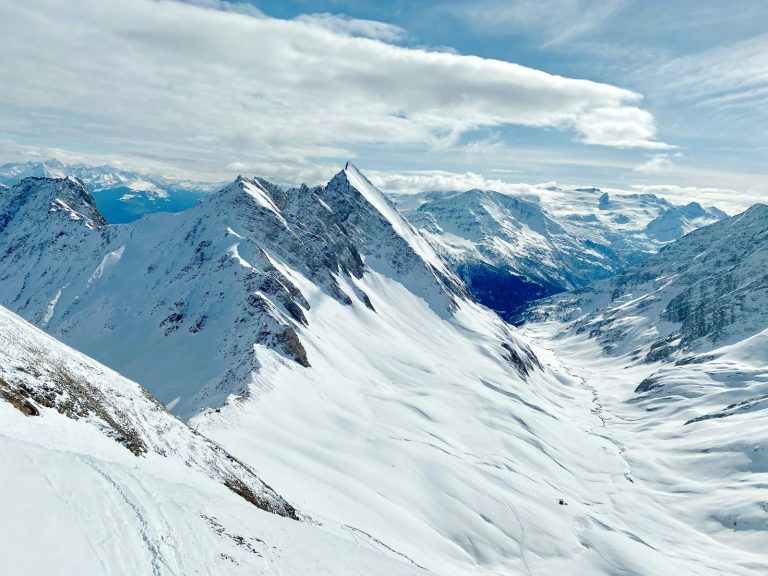 A skier on a snowy descent in the Courmayeur ski area, in the Aosta Valley
