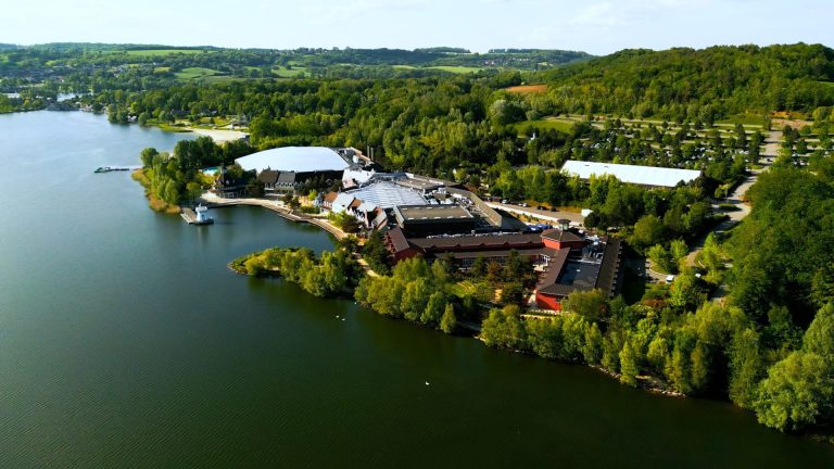 Aerial view of Center Parcs du Lac d’Ailette, between the lake and wooded hills, venue of the KPMG retreat